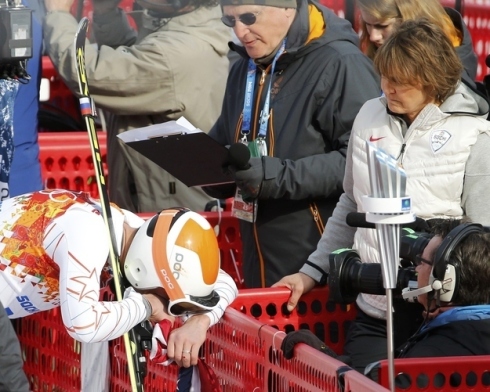 NBC's Christin Cooper looks on as Bode Miller breaks down during their interview at the 2014 Sochi Winter Olympic Games.